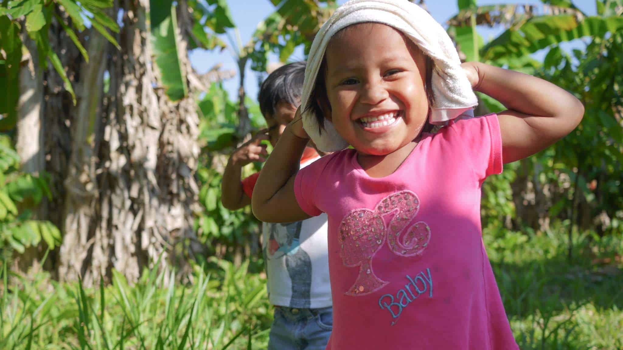 Krunam playing ball games with three children in Thailand