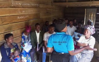 A Not For Sale DRC field worker leads a cooperative farming training session with community members in eastern Congo, 2024. Ebola outbreak DRC 2026