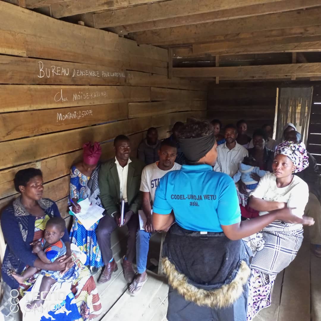 A Not For Sale DRC field worker leads a cooperative farming training session with community members in eastern Congo, 2024.